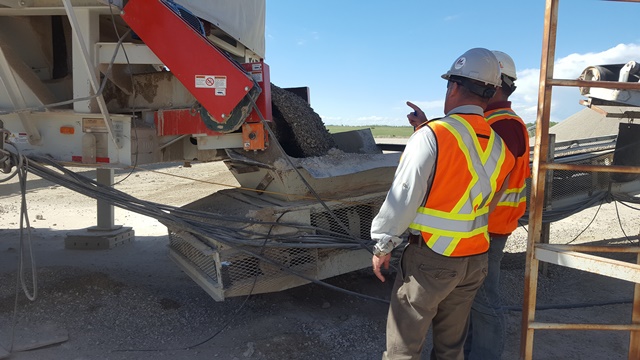 Kevin explains to Ross how the rock is crushed and washed on site.