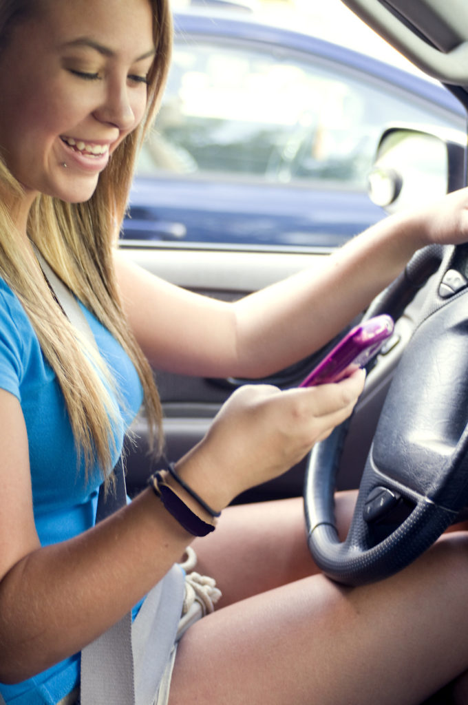 15864-a-teen-girl-texting-while-driving-pv