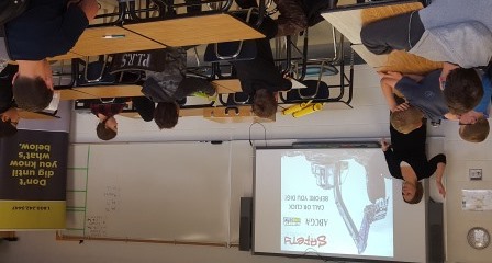 Sara giving a presentation about ground disturbance to a junior high group at a Young Farm Worker's Day